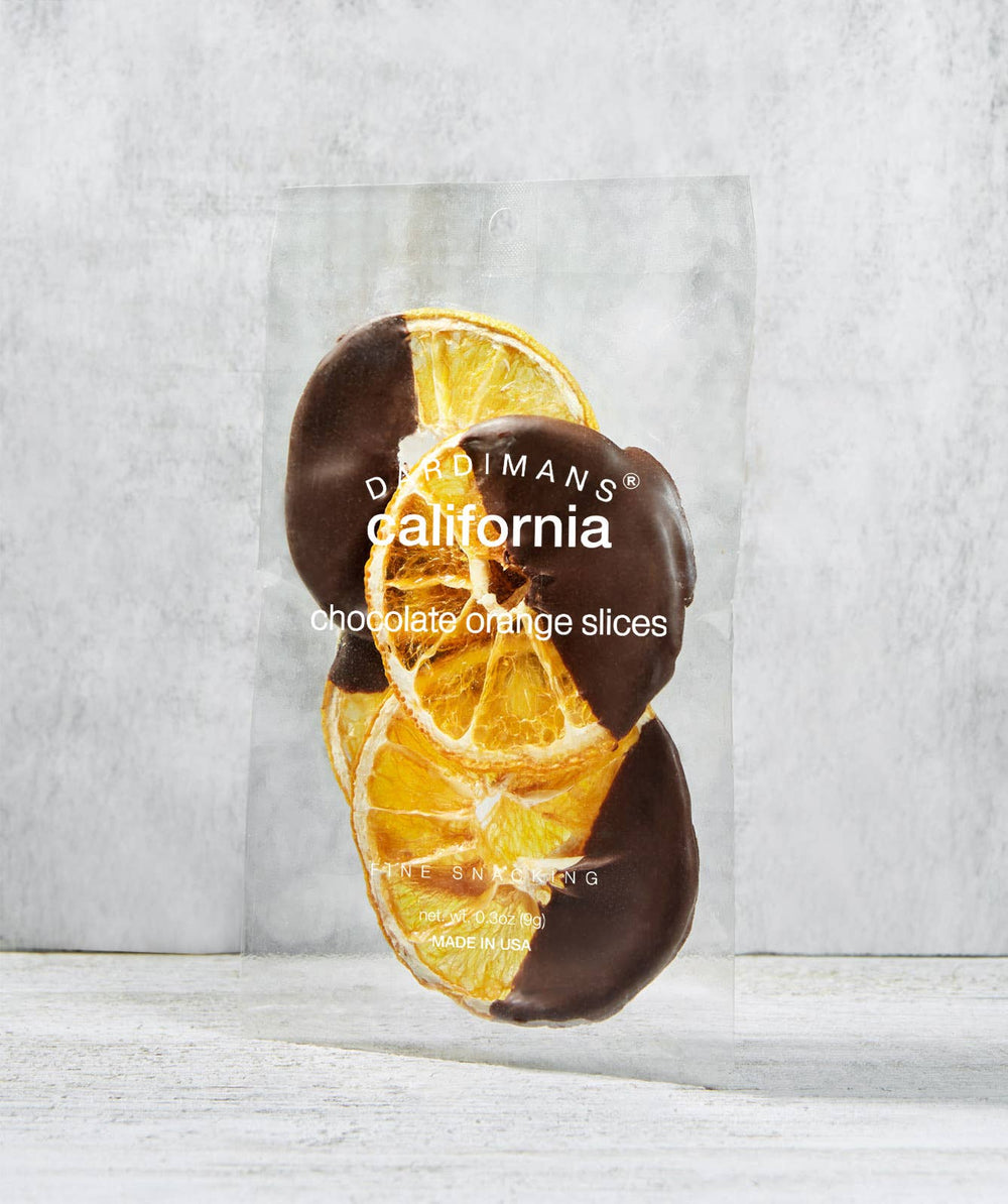Pack of chocolate orange slices with 'Dallmann's California' branding on a light gray background.